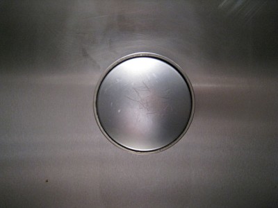 Le bouton de la chasse d'eau